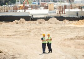 Project manager overseeing built to suit commercial project management on construction site