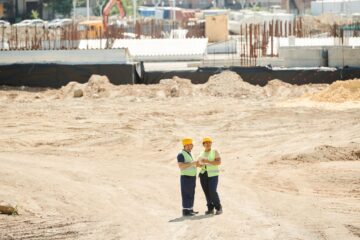 Project manager overseeing built to suit commercial project management on construction site
