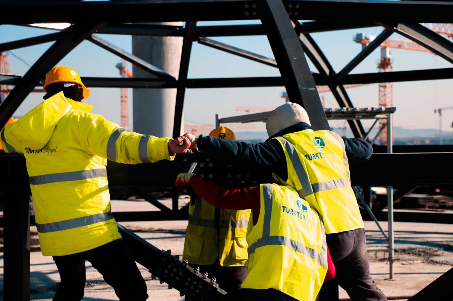 Built to suit commercial project management with project manager reviewing construction blueprints
