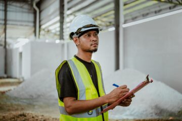 construction audit importance in project success with site inspection and blueprint