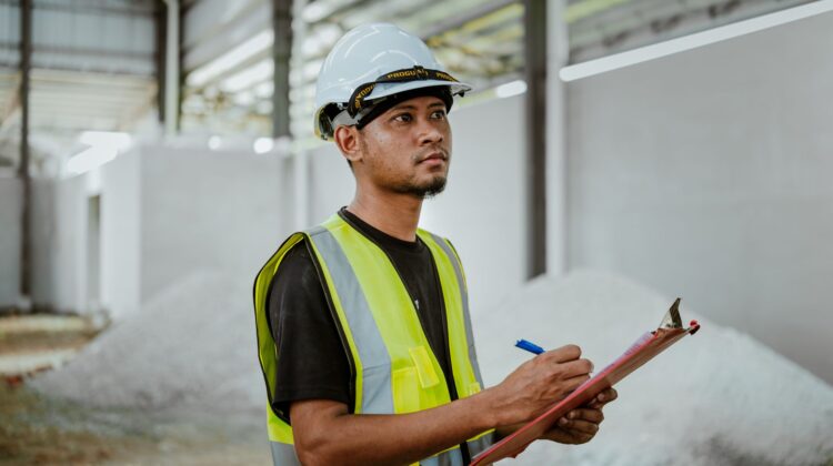 construction audit importance in project success with site inspection and blueprint