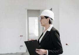 Project manager conducting construction audit checklist on commercial building site