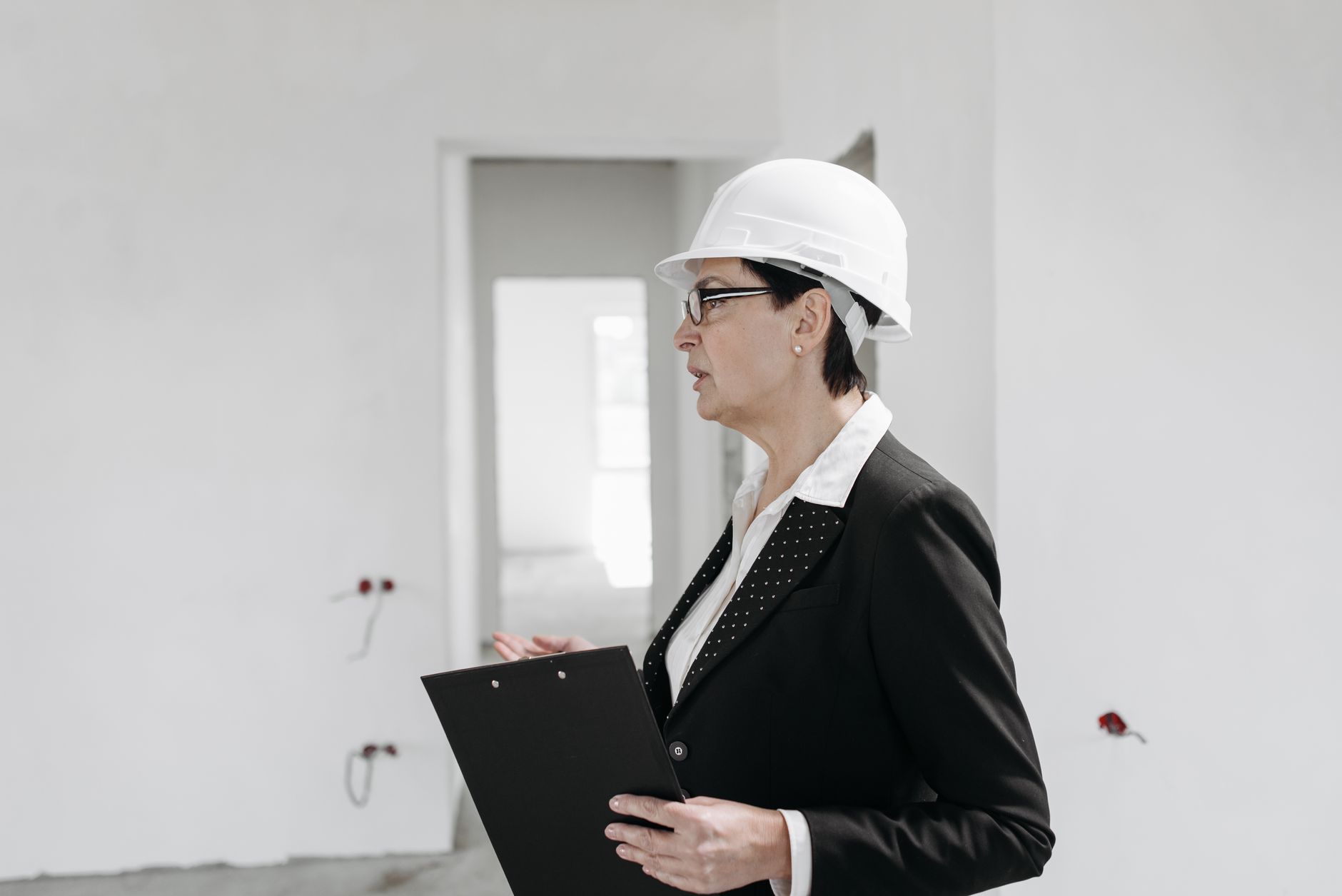 Project manager conducting construction audit checklist on commercial building site