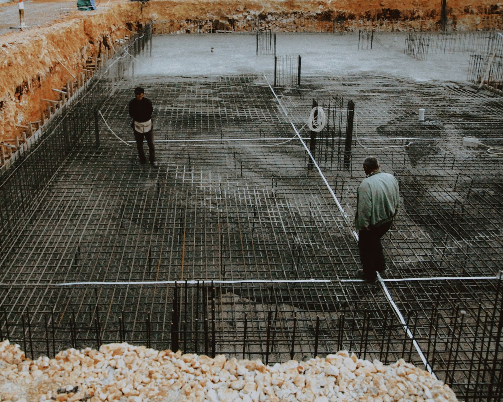 construction project management consultant reviewing blueprint for construction excellence