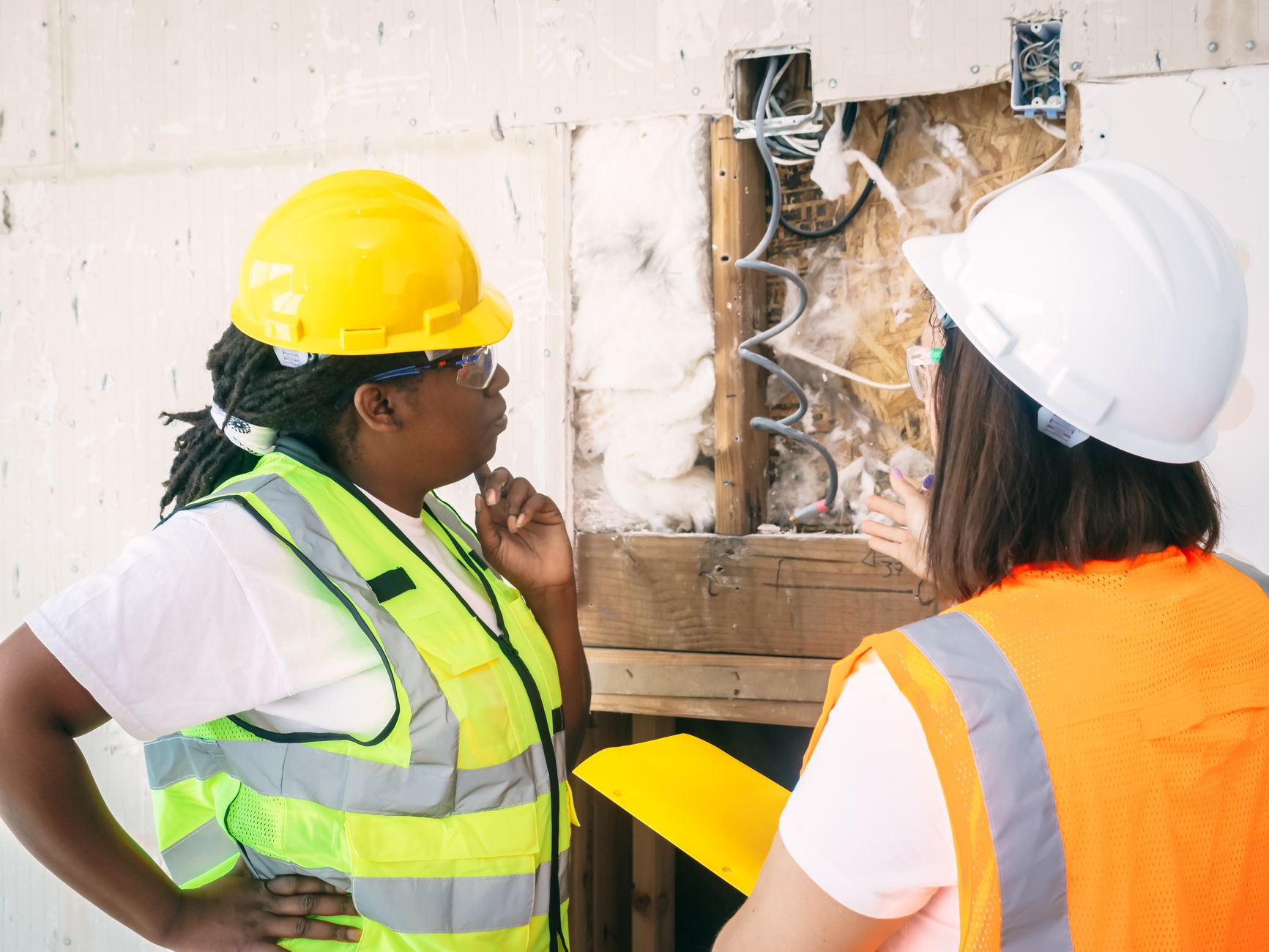 construction audit site inspection with project manager reviewing blueprint