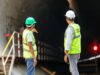 construction audit site inspection with project manager reviewing blueprint