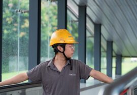 construction audit at commercial construction site with project manager reviewing blueprints
