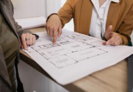 cost management in commercial construction project with site manager and blueprints