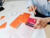 Commercial construction project manager reviewing cost management plan