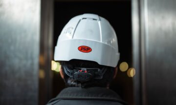 construction management project manager reviewing site blueprint