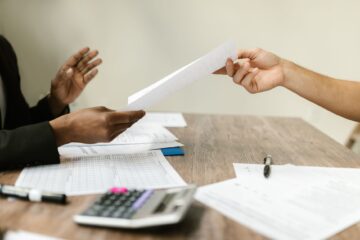 Project manager conducting contract negotiation for corporate office fitouts