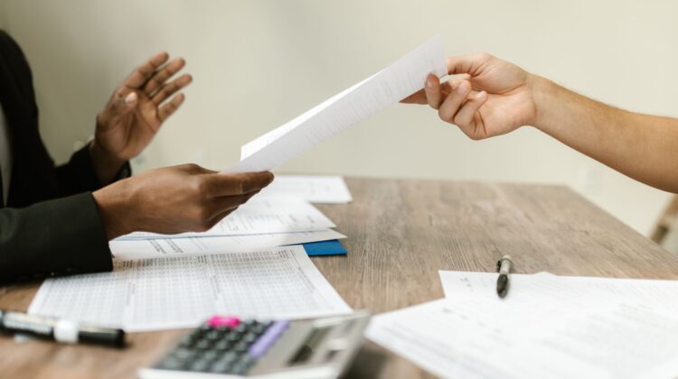 Project manager conducting contract negotiation for corporate office fitouts
