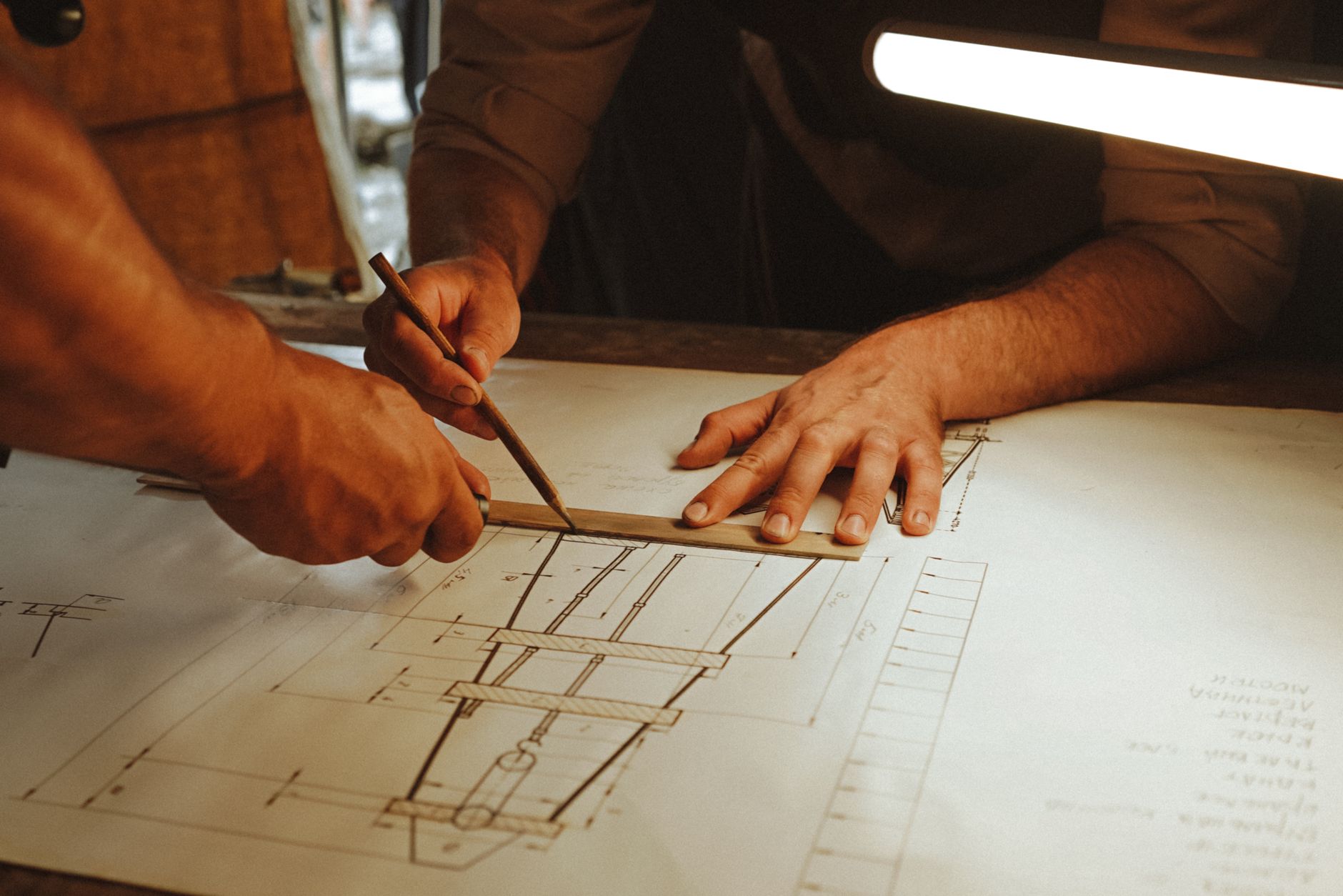 Corporate office fitout design management with project manager reviewing blueprints