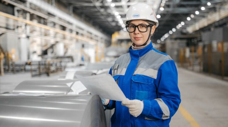 Corporate office construction site showing project manager reviewing fitout compliance checklist
