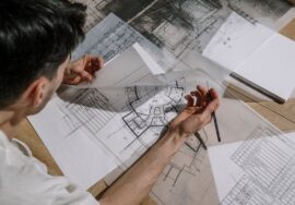 Corporate fitouts project manager reviewing construction blueprint on site
