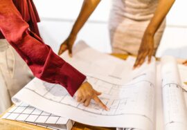Project manager reviewing plans for interior fitouts in a corporate office