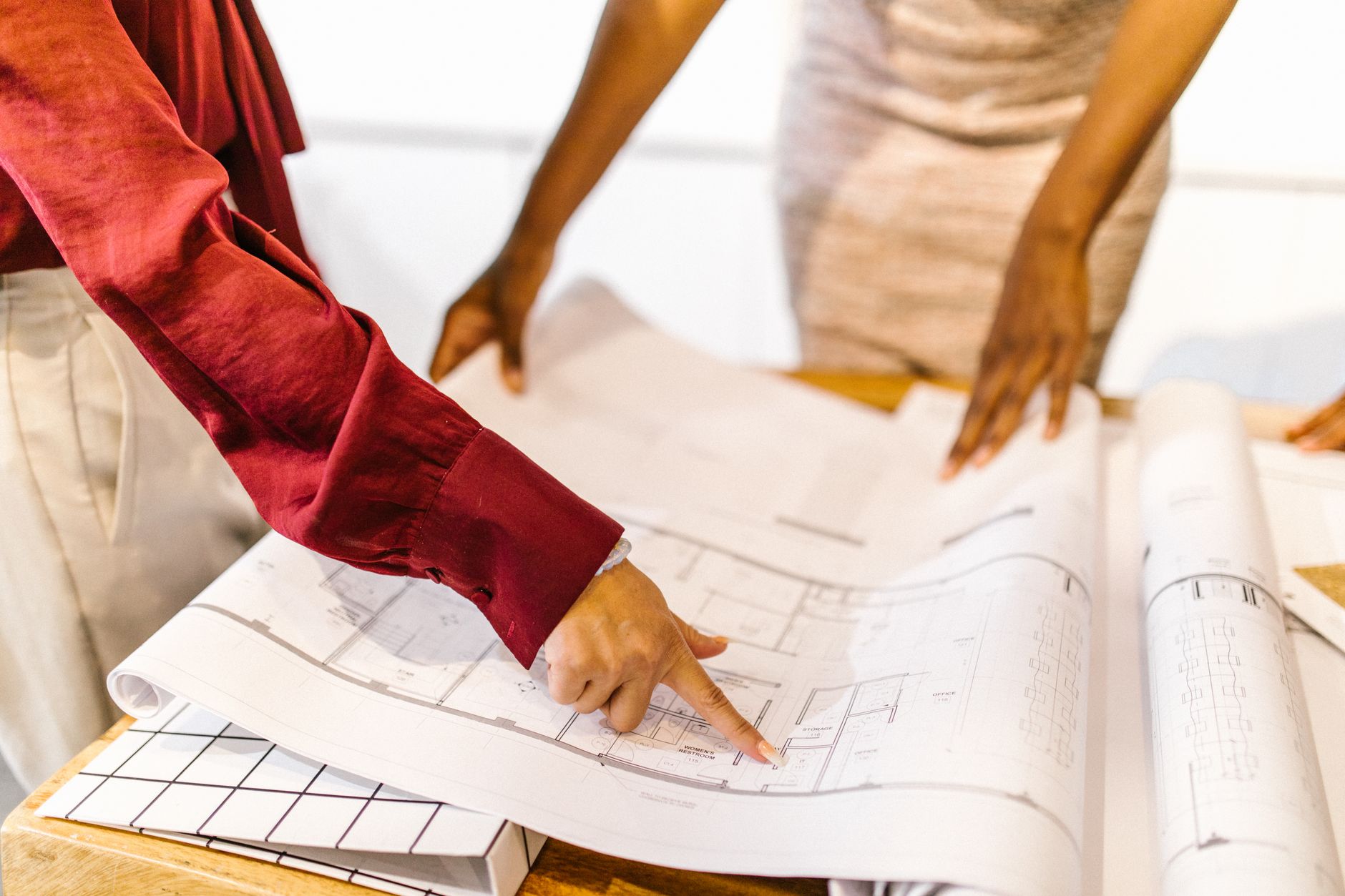 Project manager reviewing plans for interior fitouts in a corporate office
