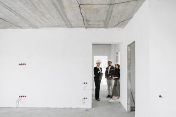 Corporate office interiors fitout with project manager reviewing office interiors plans