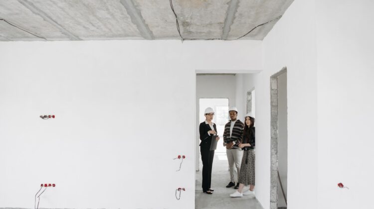 Corporate office interiors fitout with project manager reviewing office interiors plans
