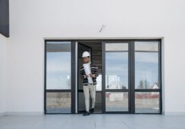 Project closeout process with construction site manager reviewing plans
