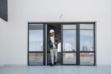 Project closeout process with construction site manager reviewing plans