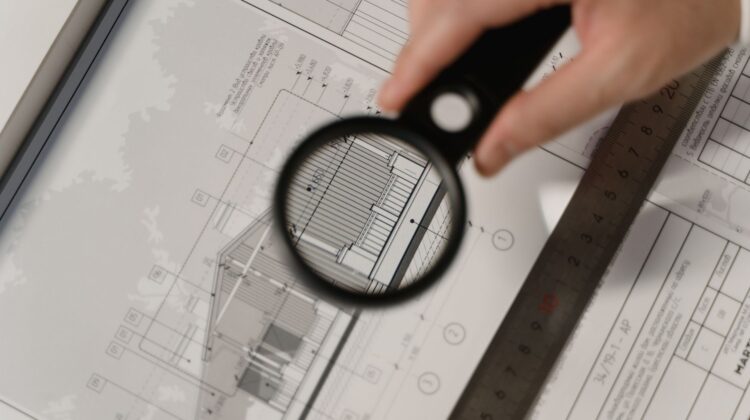 Project execution at a corporate office fitout site with project manager reviewing plans