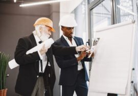 Project tracking in corporate office fitout planning with project manager reviewing progress