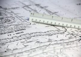 Project manager reviewing technical feasibility assessment for corporate office fitout