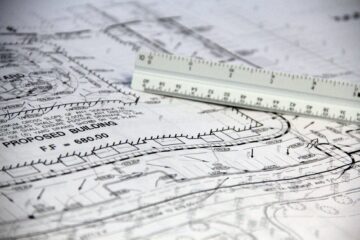 Project manager reviewing technical feasibility assessment for corporate office fitout