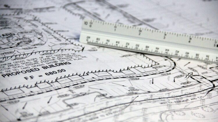 Project manager reviewing technical feasibility assessment for corporate office fitout