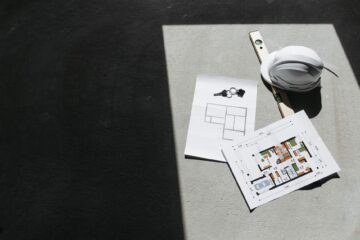 Project manager reviewing workspace design layout during office fitout project planning