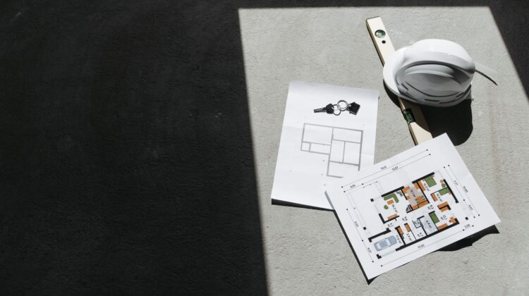 Project manager reviewing workspace design layout during office fitout project planning
