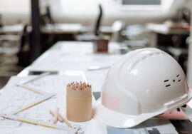 Workspace planning for corporate office fitouts with project manager reviewing blueprint