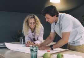 Project manager reviewing contract strategy on construction site
