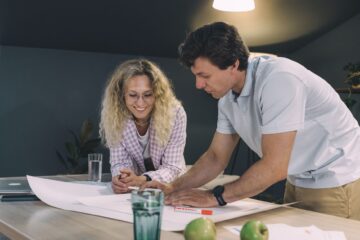 Project manager reviewing contract strategy on construction site