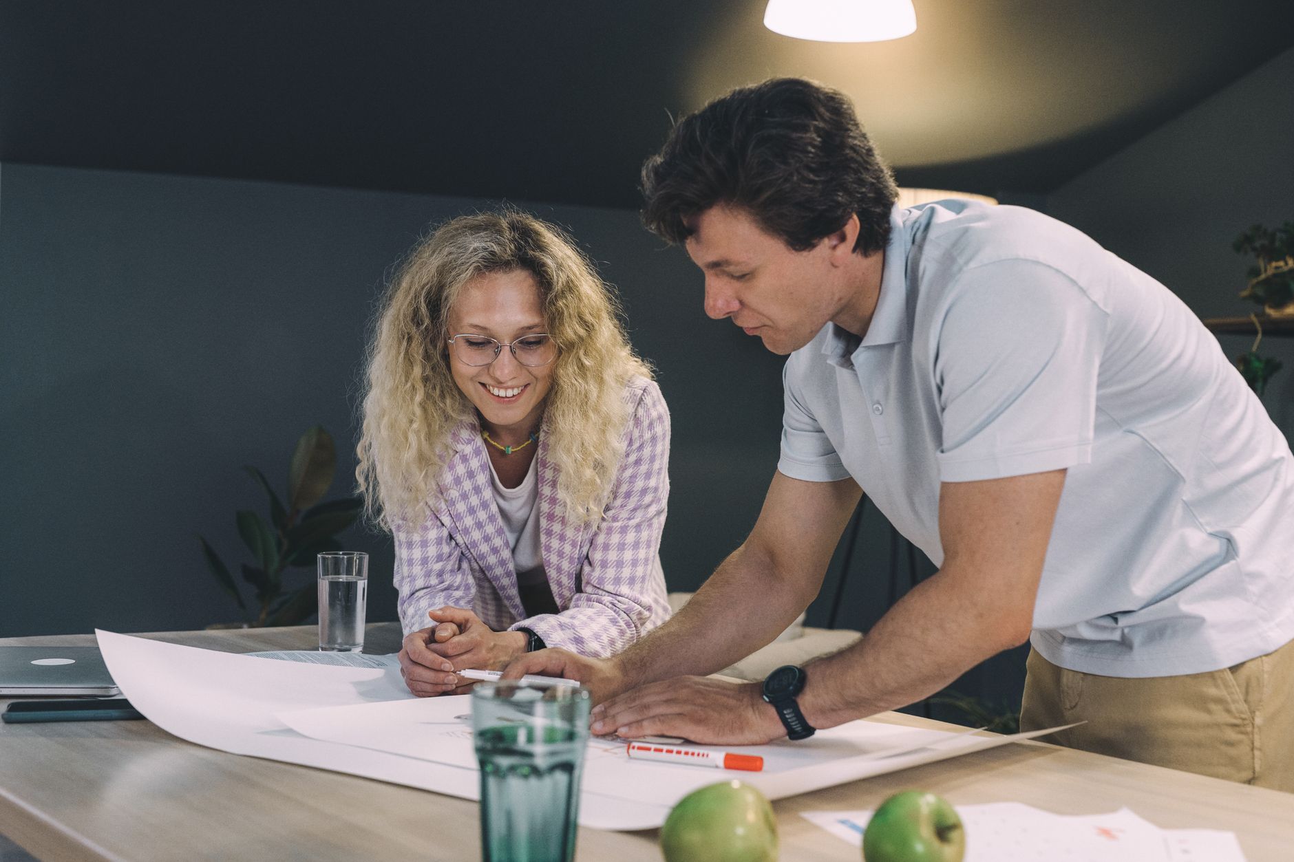 Project manager reviewing contract strategy on construction site