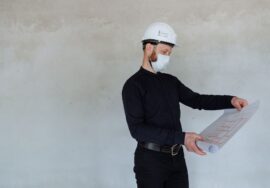 construction project manager reviewing delivery planning for construction project timelines