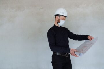 construction project manager reviewing delivery planning for construction project timelines