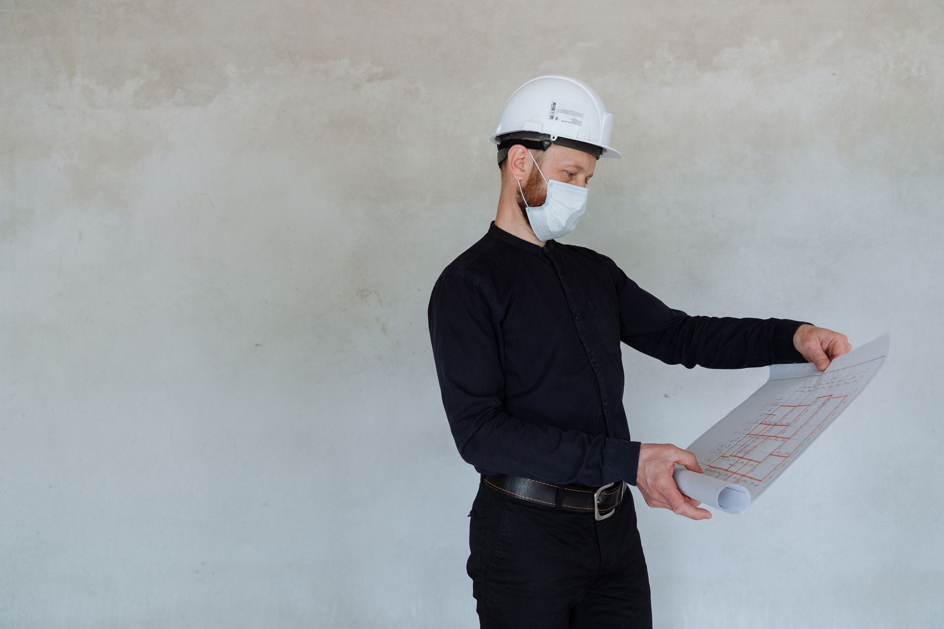 construction project manager reviewing delivery planning for construction project timelines