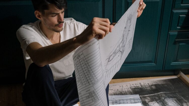 Construction project manager reviewing execution planning at site