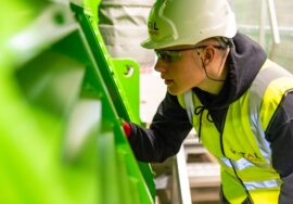 Project manager implementing construction strategy risk controls on site
