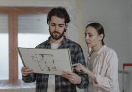 construction project planning showing critical path on blueprint