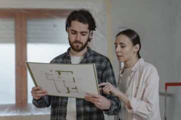 construction project planning showing critical path on blueprint