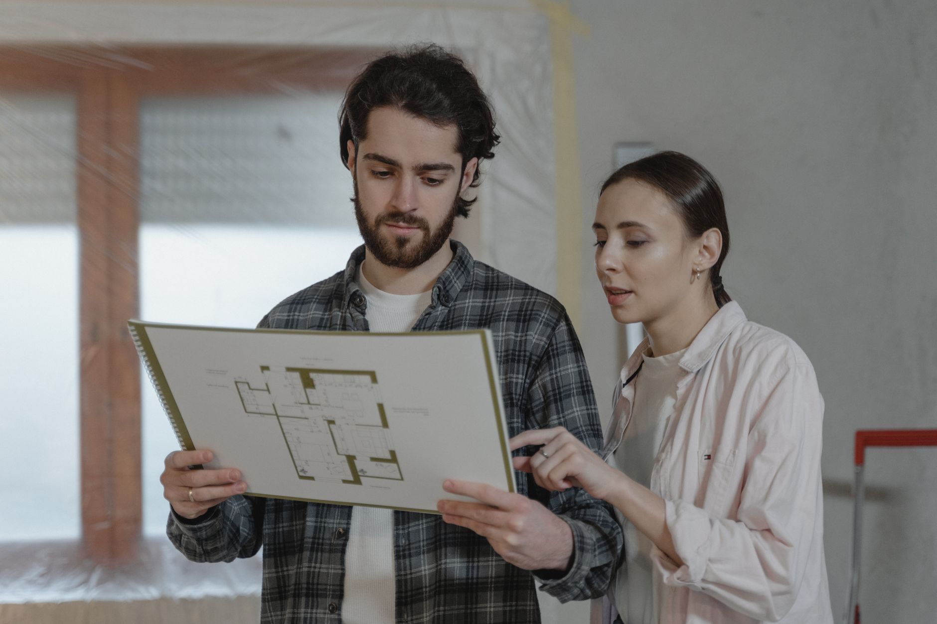 construction project planning showing critical path on blueprint