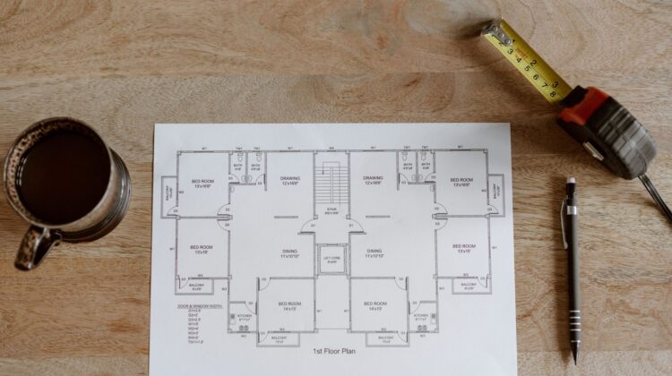 Construction project manager reviewing work breakdown for planning accuracy