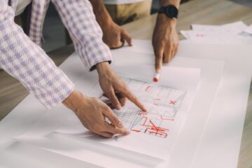 Construction project manager overseeing design integration in construction project planning