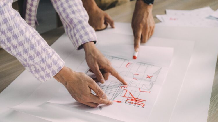 Construction project manager overseeing design integration in construction project planning
