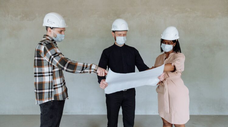 Construction site with project manager conducting constructability review