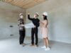 construction site with project manager reviewing safety planning checklist