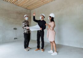 construction site with project manager reviewing safety planning checklist